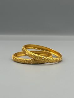 Our 24k Polished Bangles are more than just accessories; they are symbols of grace and beauty, inspired by the rich heritage of Indian, Pakistani, and Nepali jewelry. These stunning bangles showcase the timeless elegance of traditional craftsmanship, perfectly complementing your attire for weddings, festivals, or any special occasion Our company offers expedited Next-Day Delivery Services within the United Kingdom, ensuring prompt and efficient transportation of goods.  Additionally, we strive to extend our shipping capabilities to cater to customers worldwide, aiming to provide the fastest possible shipping methods to international destinations. To ensure the highest standards of hygiene, we kindly request your understanding that all sales are final, and we are unable to accept returns or Festive Yellow Gold Bangle For Anniversary, Festive Gold Bracelet With Intricate Design, Classic Handmade Gold Bangle, Traditional Gold Bracelet For Formal Festivals, Traditional Hallmarked Gold Bracelet, Traditional 22k Gold Bracelet With Intricate Design, Festive Gold Bracelets For Anniversary, Festive Yellow Gold Bracelets For Formal Occasions, Gold Bracelets For Anniversary And Festive Occasions