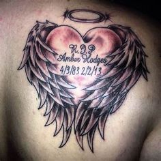 the back of a man's chest with an angel heart and wings on it