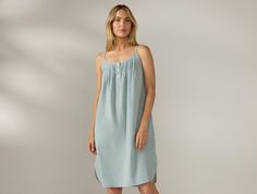 Sleep in pure organic cotton with the Women’s Isla Organic Cotton Nightgown. Gentle on your skin, breathable, and naturally hypoallergenic, it’s made from garment-washed poplin with a percale weave that becomes softer over time. Designed with adjustable straps, feminine pintuck details around the neckline and a flowy, relaxed fit that delivers restful comfort, night after night. | Coyuchi Women's Isla Organic Cotton Nightgown Medium Fawn Garden Blue Green Fabric, Cal King Bedding, Wall Decor Storage, Cotton Nightgown, Cozy Gift, Sleepwear & Loungewear, Shop Mens Clothing, Green Fabric, Chambray