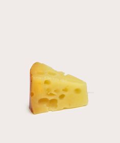 a piece of cheese on a white background