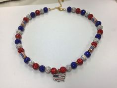 Red,white,and blue beads with Silver pendant Patriotic Blue Jewelry With Colorful Beads, Red Patriotic Necklace For 4th Of July, Blue Patriotic Necklace For Gift, Patriotic Blue Necklace For Gift, Blue Beaded Necklaces For 4th Of July, Blue Beaded Necklace For 4th Of July, Patriotic Blue Beaded Necklaces, Patriotic Blue Beaded Necklace, Patriotic Multicolor Necklaces For Gifts