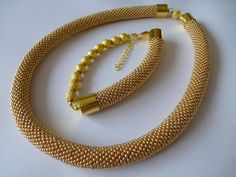 Small Czech seed beads in gold color. Very flexible and comfortable to wear. It is easy, elegant jewelry suitable for everyday use and special occasions. It is handmade especially for you. Necklace length 18.11 inch (46 cm). Bracelet length 9.06 inch (23 cm). Gold Jewelry Set, Gold Jewelry Sets, Hand Knit Hat, Bead Chain, Bead Crochet, Jewellery Sets, Bracelet Length, Gold Fashion, Elegant Jewelry