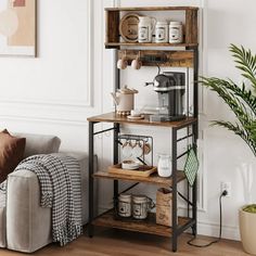 a living room with a couch, coffee maker and other items on the shelf in front of it