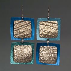 Aluminum Earrings - Named for the Mandarin word for square, these roller printed earrings are crafted from anodized aluminum and sterling silver rivets, as well as crinkled and gold-hued upcycled aluminum. Hanging from sterling silver ear wires and sure to swing delightfully with each step, each is unique and will vary in texture. Printed Earrings, Aluminum Earrings, Artful Home, Anodized Aluminum, Rivets, Ear Wires, Jewelry Earrings, Shop Now, Square