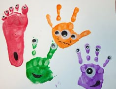 three handprints made to look like monsters