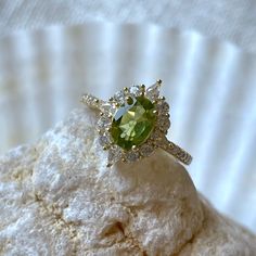 a green ring sitting on top of a rock