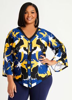 This abstract print plus size top is cut and draped in a flowing silhouette with an asymmetric hem and flare sleeves. Plus Size Dressy, Flare Long Sleeve, Statement Sleeves, Flare Sleeves, Ashley Stewart, Asymmetrical Tops, Plus Size Top, Work Tops, Knit Tees