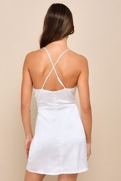 Nothing could compare to your stunning stature while wearing the Lulus Luxe Reputation White Satin Sleeveless Cowl Neck Mini Dress! Feeling chic all through the night is easy with this sleek satin dress that features a sleeveless bodice with a sultry cowl neckline and adjustable spaghetti straps that crisscross at the back. The fitted waist tops a figure-skimming, A-line skirt that finishes at a flirty mini hem. Hidden back zipper/clasp. Fit: This garment fits true to size. Length: Mid-thigh. Si Elegant Sleeveless Mini Dress With Built-in Bra, Sleeveless Satin Mini Dress With Built-in Bra, Chic Strappy Back Slip Dress For Date Night, Elegant Slip Dress With Built-in Bra And Strappy Back, Elegant Satin Dress With Strappy Back, Fitted Satin Dress With Spaghetti Straps For Summer, Elegant Lined Slip Dress For Brunch, Elegant Satin Dress With Adjustable Straps, Chic Backless Satin Dress For Bridesmaids