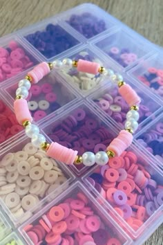 a plastic container filled with lots of different colored beads