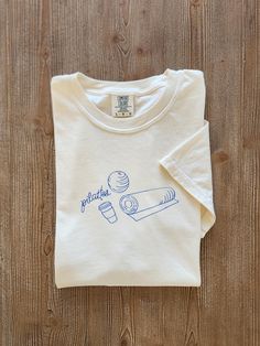 All we want is a lot of pilates and a little latte. And maybe a thick, structured tee that's also super soft and breathable. This unisex garment-dyed t-shirt ticks all the boxes and is made of 100% ring-spun cotton. The regular t-shirt style will complement most looks, and you can size up for an oversize fit. * 100% ring-spun cotton * Fabric weight: 6.1 oz/yd² (206.8 g/m²) * Garment-dyed * Relaxed fit * 7/8″ double-needle topstitched collar * Twill-taped neck and shoulders for extra durability * Coquette Pilates, Princess Pilates, Pilates Shirt, Pop Pilates, Wellness Studio, Cafe Latte, Pilates Princess, Pilates Studio, T Shirt Style