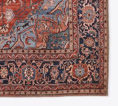 an antique persian rug with blue, red and orange colors on the middle border is shown