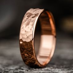 a wedding band with hammered copper inlays