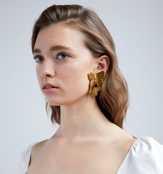 For centuries, butterflies have been symbolic of transformation and the ability to overcome, which makes them our perfect everyday mascot! The Papillon Earring is both a best-seller and a staff favorite. The curved shape of the butterflies flatteringly frame the face, while the intricately-carved details on the wings make these true wearable masterpieces.  Dimensions: 2.25in L Weight: $225.00 Elegant Butterfly Charm Earrings, Luxury Yellow Gold Butterfly Earrings, Gold Earrings With Butterfly Charm For Formal Events, Gold Earrings With Butterfly Charm For Formal Occasion, Luxury Gold Butterfly Earrings, Elegant Butterfly Earrings For Formal Occasions, Elegant Single Butterfly Earring, A Staff, The Wings