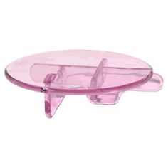 a pink plastic object on a white background