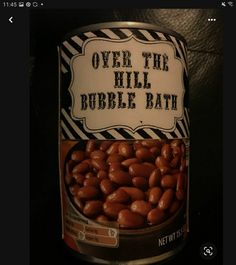 a can of peanuts with the words over the hill bubble bath on it's side