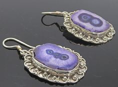 "925 Sterling Silver - Vintage Purple Agate Swirl Border Dangle Earrings - EG2986  925 Sterling Silver - Vintage Purple Agate Swirl Border Dangle Earrings - EG2986  Jewelry Type:         Earrings   Metal Type:            925 Silver   Metal Size:             1.5\"  Stone Type:            Agate   Condition:              N/A  Jewelry Weight:     10.7 Grams  PLEASE NOTE: THIS ITEM IS PRE-OWNED. ALTHOUGH MOST ITEMS ARE IN VERY GOOD CONDITION, SOME MAY NEED CLEANING AND/OR MINOR REPAIRS. WE MAKE A VER Elegant Silver Agate Earrings, Silver Agate Gemstone Earrings, Pierced Silver Agate Jewelry, Silver Agate Jewelry, Purple Agate, Earrings Metal, Vintage Purple, Antique Rings, Beautiful Necklaces