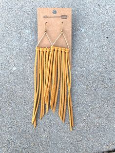 Mustard leather fringe earrings with raw brass teardrop or | Etsy Gold Tassel Earrings For Festivals, Adjustable Gold Tassel Earrings With Fringe, Yellow Fringe Tassel Drop Earrings, Gold Fringe Tassel Earrings For Festival, Leather Fringe Earrings, String Earrings, Staple Earrings, Earrings Handmade Boho, Denim Earrings