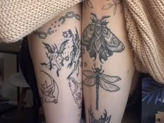 the legs of a woman with tattoos on them