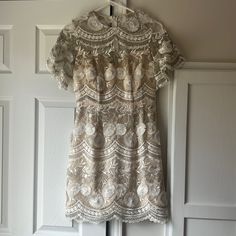 Nwt Blue Door Boutique Embroidered Dress - Size Small. It Has A Sheer Neckline With Beautiful Embroidery! I Bought This For My Rehearsal Dinner, But Unfortunately It Didn’t Work. It’s Perfect For A Summer Or Spring Bride! Short Sleeve Lace Embroidered Party Dress, White Elegant Embroidered Short Sleeve Dress, Elegant White Embroidered Short Sleeve Dress, Short Sleeve Lace Embroidered Dress For Wedding, Short Sleeve Lace Embroidered Wedding Dress, Elegant Short Sleeve Embroidered Lace Dress, Floral Embroidery Mini Dress With Short Sleeves For Wedding, Fitted Embroidered Dress With Lace Work For Spring, White Embroidered Lace Mini Dress