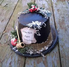 a decorated cake sitting on top of a wooden table