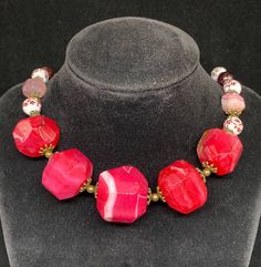 Length: 47cm (18.5in)*Weight: 133gNecklace “Wild Roses” - Pink Agate, Porcelain Beads, Garnet, Brass Accessories.Намисто “Дикі Троянди”- Рожевий агат, порцелянові намистини, гранат, латунна фурнітура.Pink Agate- a symbol of good luck. It is believed that the longer you wear pink agate, the better it works.Рожевий агат- символ щасливого випадку. Вважається, що чим довше носити рожевий агат, тим краще він діє. Garnet- the stone with the most powerful energy. Able to protect against envy, hatred an Round Stones Costume Jewelry, Adjustable Pink Stone Necklace, Pink Faceted Beads Jewelry Gift, Elegant Agate Bracelet, Pink Faceted Beads Jewelry For Gift, Pink Adjustable Necklace With Stones, Pink Faceted Beads Jewelry, Adjustable Pink Necklace With Stones, Pink Faceted Jewelry Bracelet