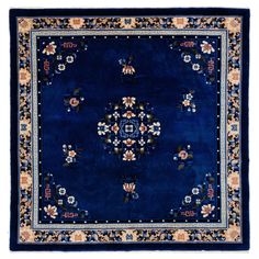 a blue rug with flowers on it