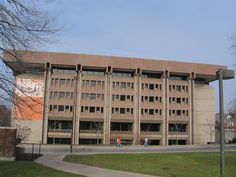 a large building with many windows on the front and side of it's sides