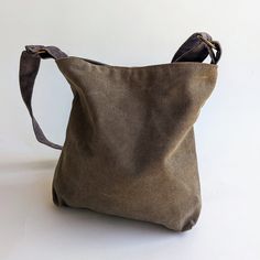 The Khaki canvas Mini May is a small size handbag, hobo bag with a chic sack like style. It can be made from a large variety of shades and fabrics. ** USAGE ** This bag is perfect for an evening out or an easy day. Fun for the young in age or spirit... ** SPECIFICATIONS ** Features: + 1 internal side pocket which closes with a Velcro snap. + Closes with a magnetic snap. Approximate Dimensions: 11" height 11" width 2" deep Strap: Short - 19" (48 cm) Crossbody - 46" (117 cm) Weight: ~200 grams ** Canvas Crossbody Bag With Canvas Lining, Canvas Crossbody Shoulder Bag With Canvas Lining, Khaki Hobo Shoulder Bag With Removable Pouch, Rectangular Canvas Hobo Bag With Adjustable Strap, Canvas Hobo Bag, Everyday Use Canvas Bucket Bag With Removable Pouch, Everyday Use Bucket Canvas Bag, Khaki Canvas Crossbody Bag, Canvas Bucket Shoulder Bag With Removable Pouch