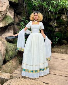 This dress is a stunning example of traditional elegance with a modern simplicity, perfect for both formal occasions and cultural celebrations. Made from soft, breathable white fabric or menen and dark green Tilf, the dress flows beautifully to create a relaxed yet sophisticated silhouette. Material Cotton Menen Thread Estimated delivery : 1 week to 10days Contact WhatsApp +1(304)-306-2784Email: contact@ethiopian.store