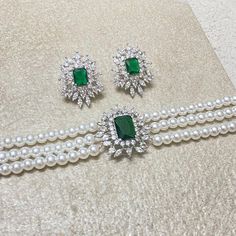 Emerald choker features beautiful big emerald cut green gemstone with pearls and CZ diamonds in it. Handmade with elegance, it's a perfect blend of sophistication and style. Ideal for weddings or as a bridesmaid gift, this necklace makes a thoughtful and beautiful present for your sister, adding a touch of luxury to any occasion. *𝐏𝐑𝐎𝐃𝐔𝐂𝐓 𝐃𝐄𝐓𝐀𝐈𝐋* * 𝐌𝐚𝐭𝐞𝐫𝐢𝐚𝐥: Brass * 𝐏𝐥𝐚𝐭𝐢𝐧𝐠: White Rhodium Plated * 𝐒𝐭𝐨𝐧𝐞: AAA-quality CZ Diamond & Emerald. *𝐃𝐈𝐌𝐄𝐍𝐒𝐈𝐎𝐍𝐒* *? Elegant Green Choker Jewelry, Pearl Gemstone Jewelry For Party, Party Jewelry With Pearl And Gemstone, Party Pearl Gemstone Jewelry, Elegant Green Pearl Necklace For Gift, Luxury Emerald Necklace For Wedding, May Birthstone, Exquisite Emerald Necklace For Wedding May Birthstone, Exquisite Emerald Necklace For Wedding And May Birthstone, Formal Green Pearl Necklaces