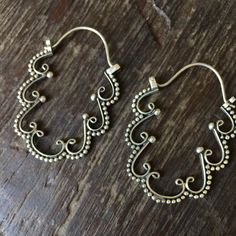 Handmade floral sterling Silver Hoop Earrings Approximate dimensions ; H 1.75" x W 1.25" Metal Hoop Jewelry With Intricate Design, Intricate Hoop Metal Jewelry, Ornate Hoop Jewelry For Pierced Ears, Ornate Handmade Hoop Earrings, Handmade Ornate Hoop Earrings, Ornate Pierced Hoop Earrings, Vintage Silver Hoop Earrings With Ear Wire, Ornate Handmade Brass Hoop Earrings, Silver Pierced Brass Flower Earrings