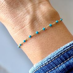 Featuring genuine 2mm Turquoise stone beads evenly spaced apart, this exquisite bracelet is meticulously crafted with turquoise stones that radiate a captivating natural beauty and delicately strung on a high-quality 14K gold-plated sterling silver chain, ensuring both elegance and durability. 🎁 Item ships nicely packaged ready to gift in elegant jewelry boxes. ♻️ Our jewelry boxes are reusable and recyclable PRODUCT DETAILS: Material: Solid 925 Sterling Silver  Finish: 14K Gold  Closure:  Spring Lock Clasp Stone: Turquoise Gemstones Dimensions: 2mm Bracelet Lengths: 5" - 9" HOW TO ORDER * In the drop down menu, select from bracelet options * Bracelet is available in multiple lengths  * Pricing is listed for each option individually * Confirm size before ordering, see guide below.  BRACEL Turquoise Bead Bracelet, Custom Bracelet, Turquoise Stones, Custom Bracelets, Laguna Beach, Turquoise Gemstone, Bracelet For Women, Turquoise Beads, Elegant Jewelry