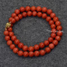 Thank you for coming in! Classic 18K solid gold necklace with Mediterranean Sardinia Coral sphere bead, no dye, 100% natural tomato red color. 49.8 grams~Our favorite color for coral! Manufactured in Italy, AAA quality! You'll get the necklace you see! SIZE of coral: Appr. 8.3mm-9mm Weight: 49.8 grams MATERIAL: 18k Solid gold, Natural coral Formal Single Strand Red Coral Necklace, Elegant Red Coral Jewelry With 8mm Beads, Elegant Orange Jewelry With 8mm Beads, Elegant Red Coral Round Bead Necklaces, Luxury Red Coral Necklaces, Elegant Red Coral Round Bead Necklace, Yellow Gold Necklaces With 8mm Round Beads, Yellow Gold Necklaces With 8mm Beads, Luxury Red Coral Necklace