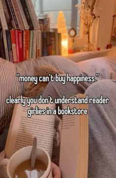 someone is reading a book and holding a cup of coffee in their lap with the caption money can't buy happiness clearly you don't understand reader girls in bookstore