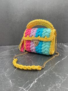 Title: Colourful Crossbody bag, Multi Color Bag, Hand Woven Crossbody Bag, Crochet Shoulder Bag, Luxury Cotton Bag, Cotton Purse,Handmade gift, Gift for her Strap - 100 cm Height: 18-20cm  Length: 22-23cm ✨FUNCTIONAL USE: Bags Planet bohemian purse has two different uses, both as a hand bag and as a crossbody bag. In the summer months, you can use this color bag according to the invitation you will attend by making a handbag. 🧼WASHING: It is not recommended to wash the Bags Planet yarn bag in the washing machine because the accessories are damaged after washing. It is recommended to clean it with a damp cloth. 🎁A UNIQUE GIFT: This unique knitted bag has a stylish look with its unique design. You can show your value to your loved ones by gifting this hobo bag to your loved ones on special Luxury Yellow Pouch Shoulder Bag, Yarn Purse, Crossbody Bag Crochet, Pouch Crochet, Bohemian Purse, Multi Colored Bag, Cotton Purse, Purse Crochet, Gift Luxury