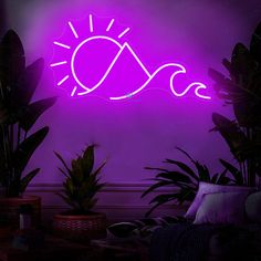 a purple neon sign with the sun and waves on it in front of some potted plants