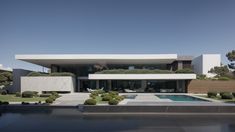 a house with a pool in front of it and lots of greenery on the outside