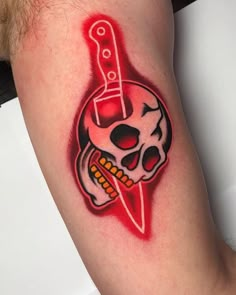 a skull with a knife on it's arm is shown in red and white