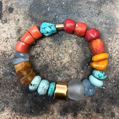 ANCIENT STONES WITH 22K GOLD CLOSURE • DESIGNED AND HAND FORGED IN NEW YORK • STONES: CORAL, TURQUOISE, AND AMBER BEADS • LENGTH: 6.5 INCHES Please email info@elihalili.com or call the studio at 212-941-7979 for any inquiries. Artisan Gold Beaded Bracelets, Turquoise And Coral Jewelry, Bohemian Gold Bracelets With Gemstone, Gold Fusion Bracelets With Round Beads, Gold Bracelet With Unique Round Beads, Gold Bracelets With Unique Round Beads, Gold Artisan Round Bracelet, Artisan Gold Round Bracelet, Artisan Gold Round Bracelets