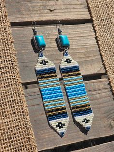 Goregous loom beaded earrings dangled from faux turquoise hook earrings. A set of simple yet western elegant Handwoven Turquoise Bohemian Earrings, Bohemian Handwoven Turquoise Earrings, Southwestern Handmade Earrings For Beach, Handmade Southwestern Drop Earrings, Southwestern Adjustable Dangling Bead Earrings, Southwestern Style Beaded Drop Earrings, Adjustable Southwestern Beaded Earrings For Beach, Southwestern Style Handwoven Dangle Jewelry, Southwestern Dangle Beaded Earrings