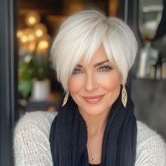 capecod8999 A pretty 50 year old woman with Sleek White Pixie 655733f3 f2d5 4919 ae94 cd1c2e39c82a 2 Platinum Short Hairstyles, Center Part Short Bob, White Hair With Dark Lowlights, Pixie Bob Fine Hair, White Bob Haircut, Short Bobs For Fine Hair Over 50, Pixie Bob Haircut Layered, Icy Blonde Short Hair, Back Of Pixie Haircut