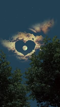 a heart shaped cloud in the sky with trees around it and a full moon behind it