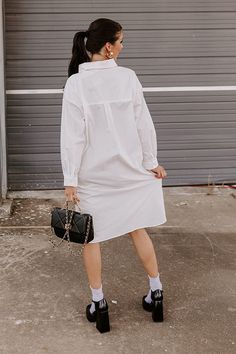 We have no doubt you were born to be stylish, so we know you'll look amazing in this basic white dress! It features lightweight material, a button up front with a collared neckline, long loose sleeves, and a relaxed silhouette that falls into a rounded mid-thigh length hemline! Measurements S : Bust 50", Hip 50", Length 40.5", Sleeve Length 19.5", Waist 50". M : Bust 52", Hip 52", Length 41.5", Sleeve Length 20", Waist 52". L : Bust 54", Hip 54", Length 42", Sleeve Length 20", Waist 54". White Solid Color Button-up Shirt Dress, White Button-up Solid Color Shirt Dress, White Button-up Shirt Dress, Cotton Solid Color Shirt Dress For Daywear, Cotton Shirt Dress In Solid Color For Daywear, White Solid Color Shirt Dress, White Long Sleeve Solid Shirt Dress, White Solid Color Shirt Dress For Daywear, White Shirt Dress For Daywear