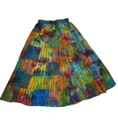 Presenting PuzzleStack’s exquisitely crafted Tie Dye Patchwork Skirt - a true manifestation of Boho Hippie style, carefully handmade to perfection! Crafted from up-cycled, premium cotton fabric, this skirt not only adds a touch of sustainability but also ensures unparalleled comfort with its loose-fitting design.Designed for your utmost convenience, the skirt features an elastic waist with a convenient drawstring, allowing you to customize the fit to your preference effortlessly. What sets this Multicolor Relaxed Cotton Skirt, Fitted Multicolor Cotton Maxi Skirt, Multicolor Cotton Maxi Skirt For Spring, Hippie Multicolor Lined Skirt, Cotton Patchwork Long Skirt, Long Cotton Patchwork Skirt, Cotton Long Skirt With Patchwork, Multicolor Tiered Hippie Skirt, Cotton Multicolor Gathered Maxi Skirt