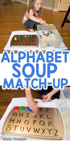 two children are sitting at a table with alphabet soup mats on it and one child is playing with letters