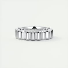 a white gold wedding band with four rows on the outside and one row in the middle