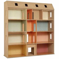 a wooden doll house with multiple shelves and doors