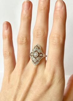 Once in a Blue Moon vintage finds! Art Deco Filigree Ring // Antique Remake Contains a total of 12 flawless CZ gemstones in an art deco geometric setting.  Size:  5-10 US Metal purity: Solid 925 Sterling Silver Weight: 2.6 g Band width: 2.0 mm Free Shipping, comes in ring box ready to gift! ~Why Cubic Zirconia?~ CZ is a lab created stone with the closest resemblance to Diamond. In recent years, developers have succeeded in adding color to CZ, making it an affordable alternative to almost any gem Renewing Wedding Vows, English Estate, Art Deco Filigree, Art Deco Rings, Once In A Blue Moon, Deco Rings, Art Deco Geometric, Moon Vintage, Earring Box