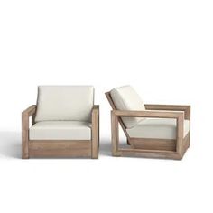 two wooden chairs sitting next to each other