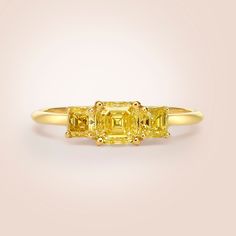 Three-Stones Ring, 1.30 Carat Asscher Cut VS1 Diamond, Diamond Ring, Engagement Ring, Diamond Fancy Yellow Diamond,18k Yellow Gold Gold metal: 18K Yellow gold Diamond Shape: Asscher Cut Main Stone: 0.70 Ct Side Stones: 0.60 Carats Total Carat Weight: 1.30 Ct Color: Fancy Yellow Clarity: VS1 Comments: Natural Diamonds Side Stones Clarity: VS1 Side Stones Color:Fancy Yellow Cut: Excellent All products come with a Certificate. Please feel free to contact me for any questions or details, gold upgrad Fine Jewelry 14k Gold Yellow Diamond Ring, Luxury Yellow Gold Sapphire Ring With Diamond Cut, Luxury Sapphire Ring With Three Stone Baguette Cut, Luxury Three Stone Sapphire Ring With Baguette Cut, Luxury Three-stone Sapphire Ring With Baguette Cut, Elegant 14k Gold Yellow Diamond Ring, Luxury Gia Certified Cluster Ring In Yellow Gold, Elegant Yellow 14k Gold Diamond Ring, Luxury Yellow Asscher Cut Ring